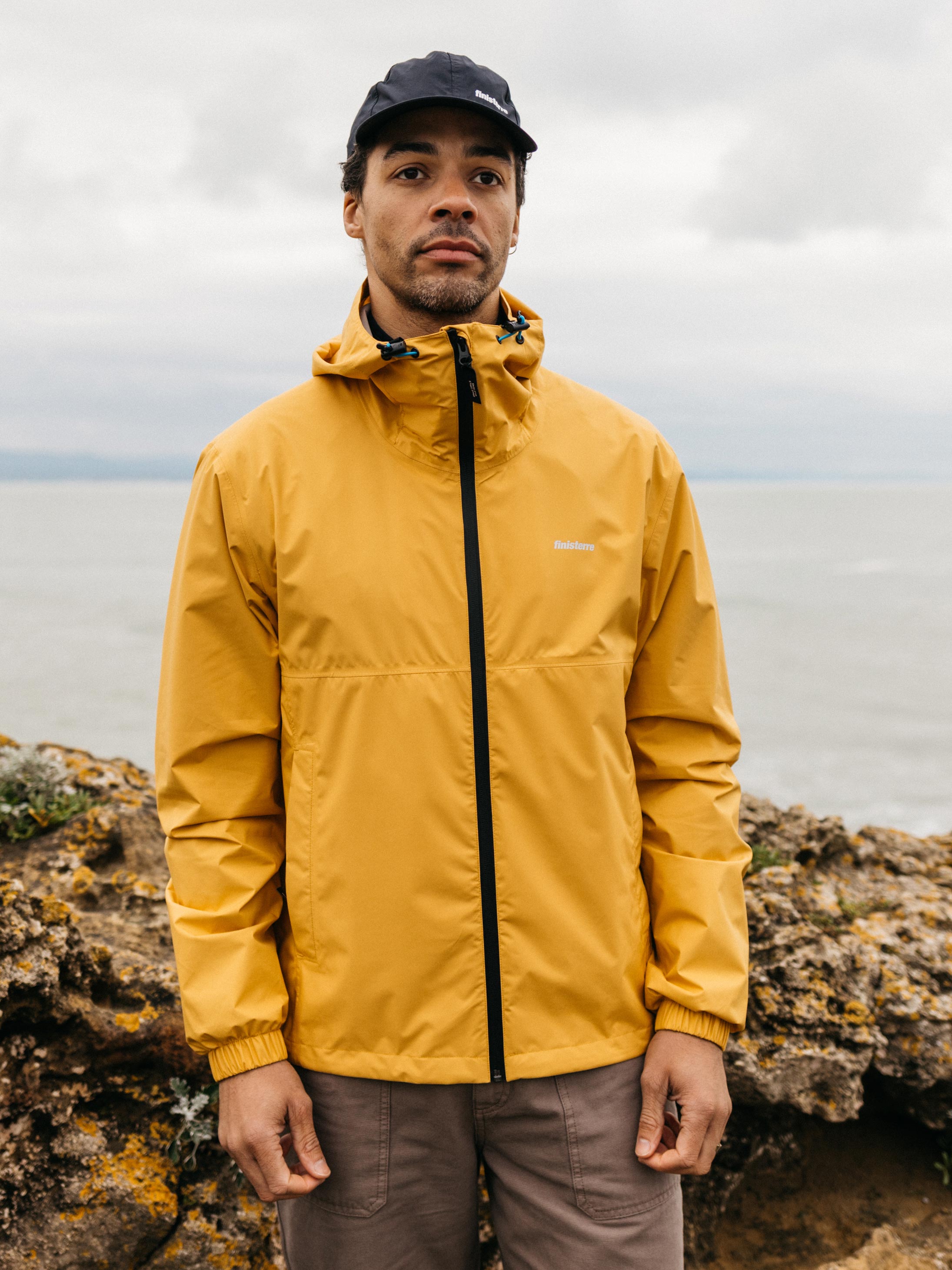Men Recycled Waterproof Jacket in Orange - Rainbird