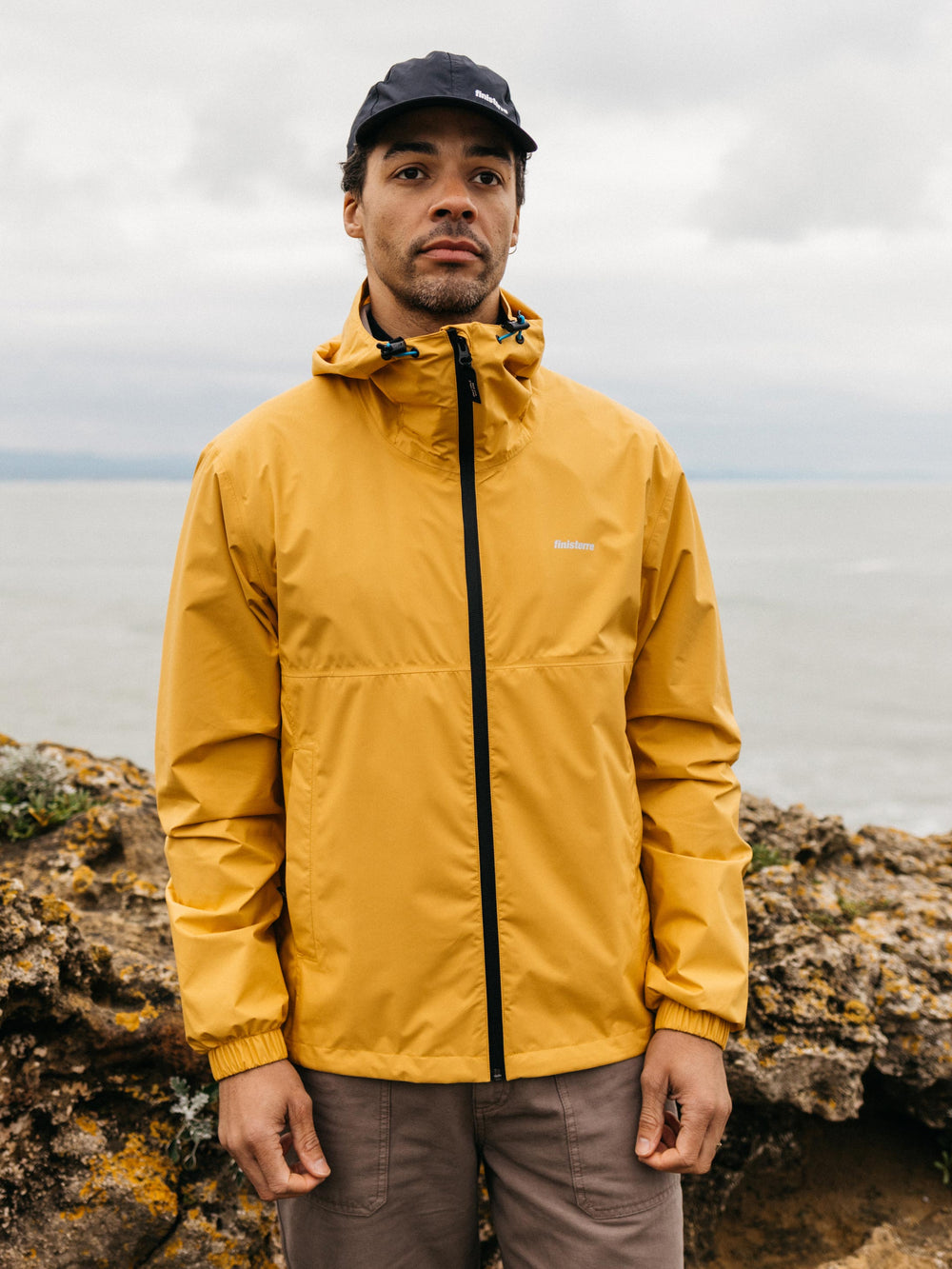 Men Recycled Waterproof Jacket in Orange - Rainbird