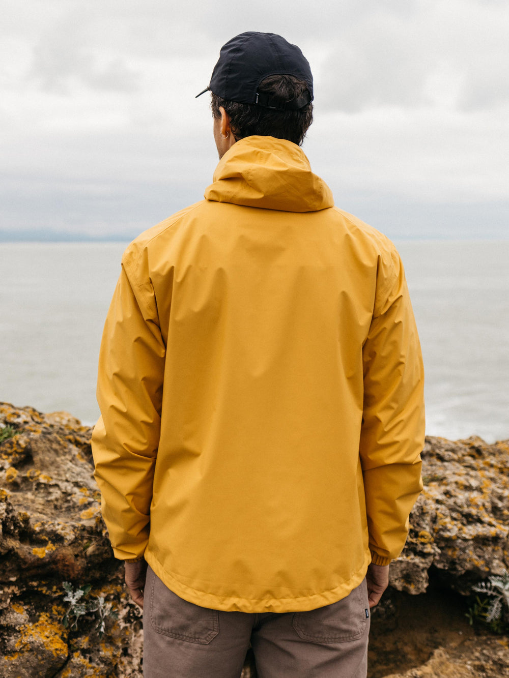 Men Recycled Waterproof Jacket in Orange - Rainbird