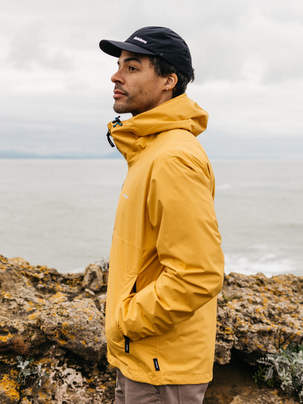 Men Recycled Waterproof Jacket in Orange - Rainbird
