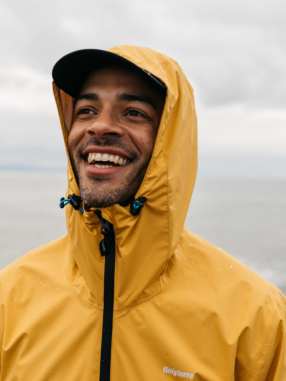 Men Recycled Waterproof Jacket in Orange - Rainbird